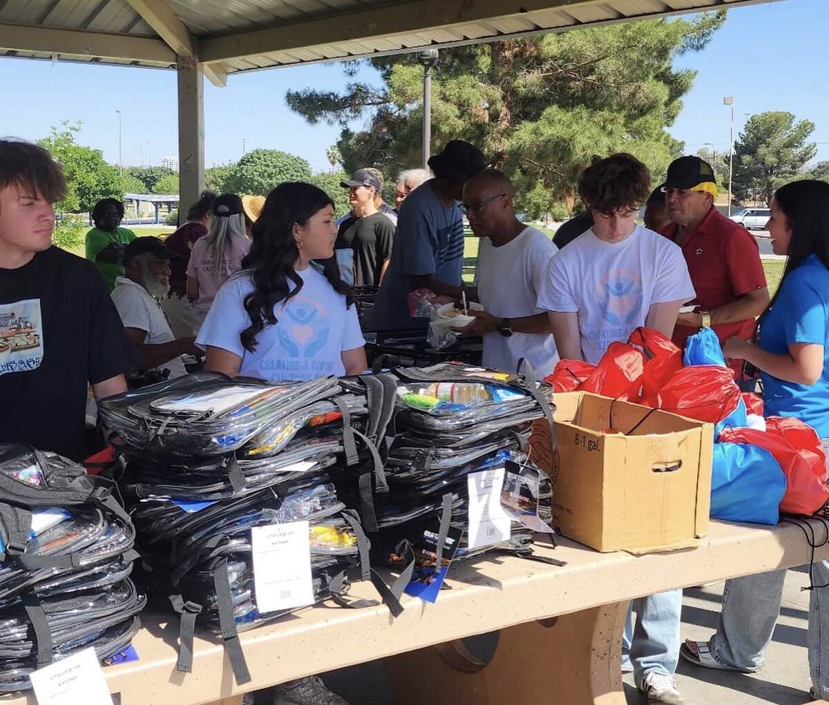 Creating a Giving Culture LV volunteers preparing backpacks and supply bags for distribution